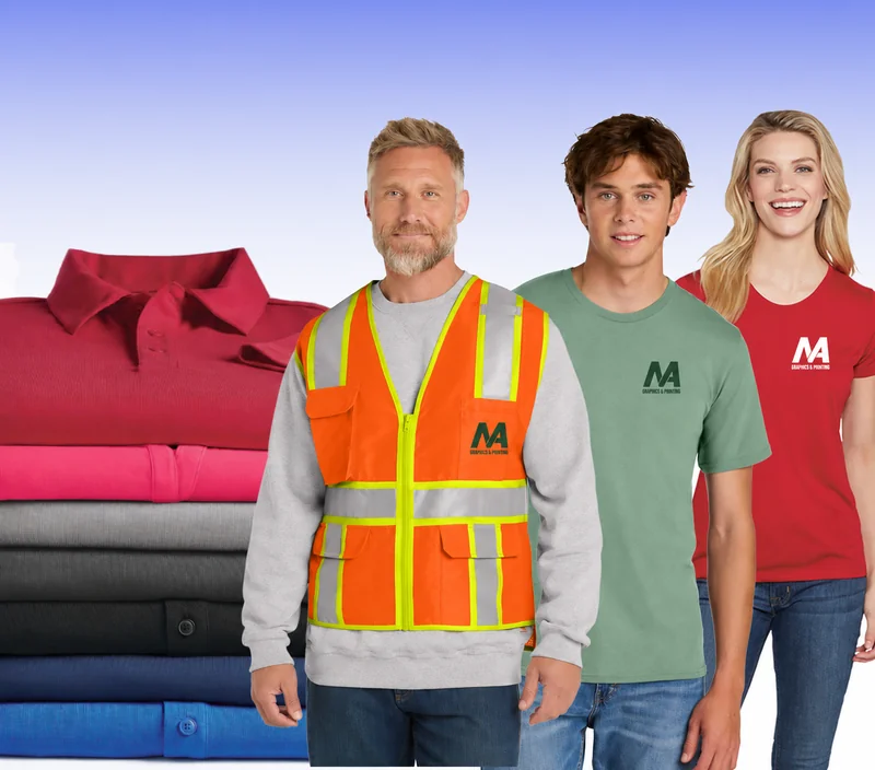 MA Graphics apparel showcase with branded shirts, a safety vest and folded polos