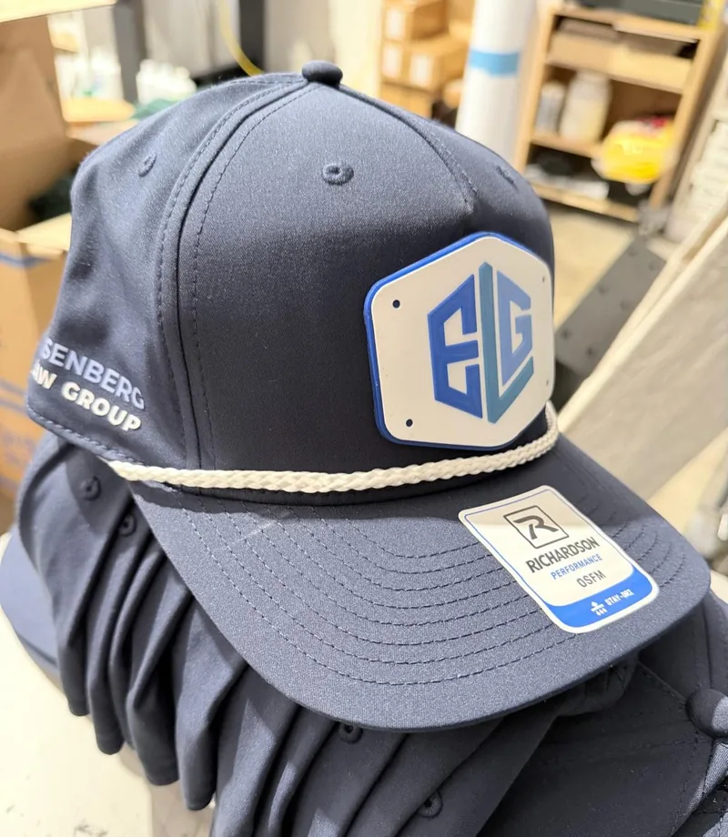 Navy caps with a custom ELG logo patch and lettering