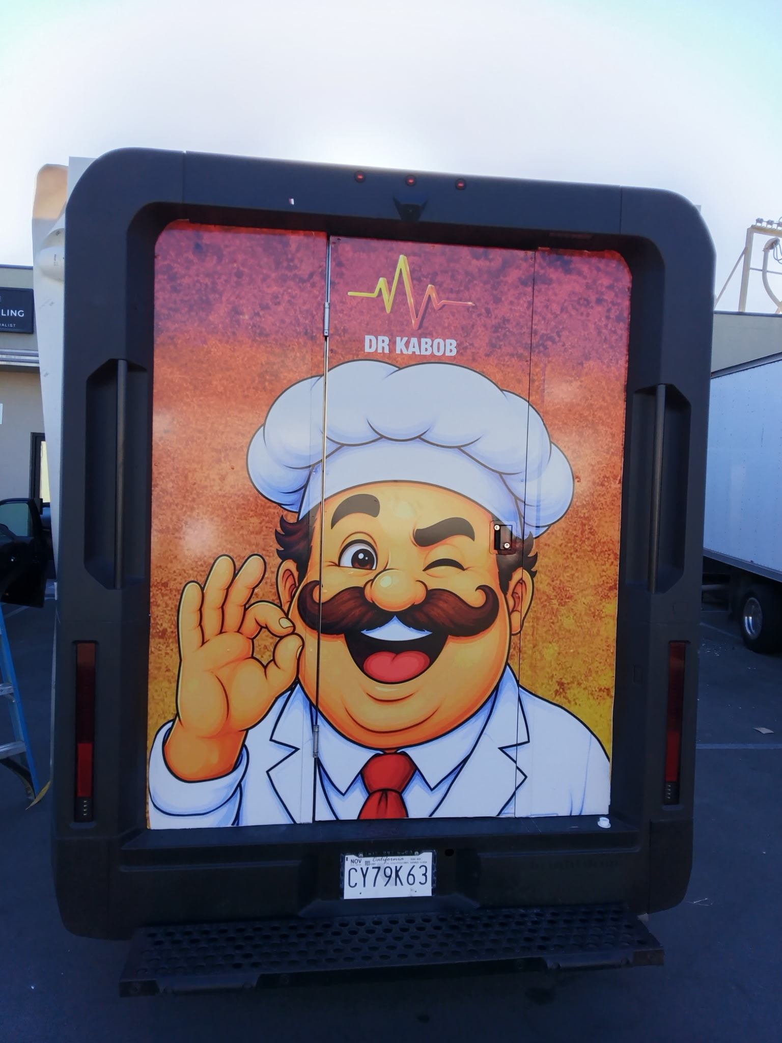 Colorful Dr. Kabob graphic on the back of a food truck