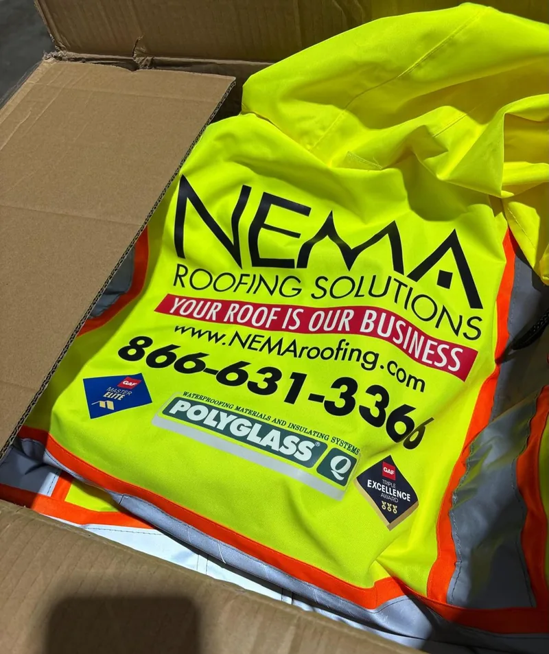 High-visibility yellow safety vest printed with NEMA Roofing Solutions branding